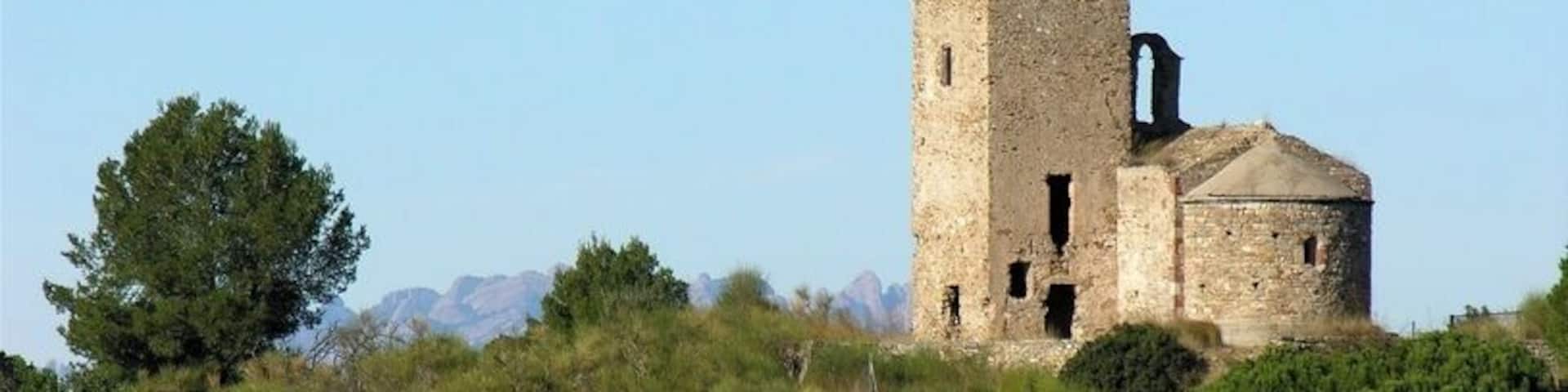 Vessant de migdia del conjunt de torre i església