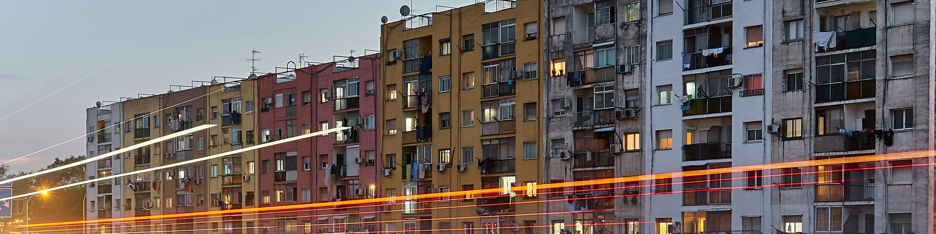 Building facade behind the highway during night time in Cerdanyola del Valles, Catalunya, Spain