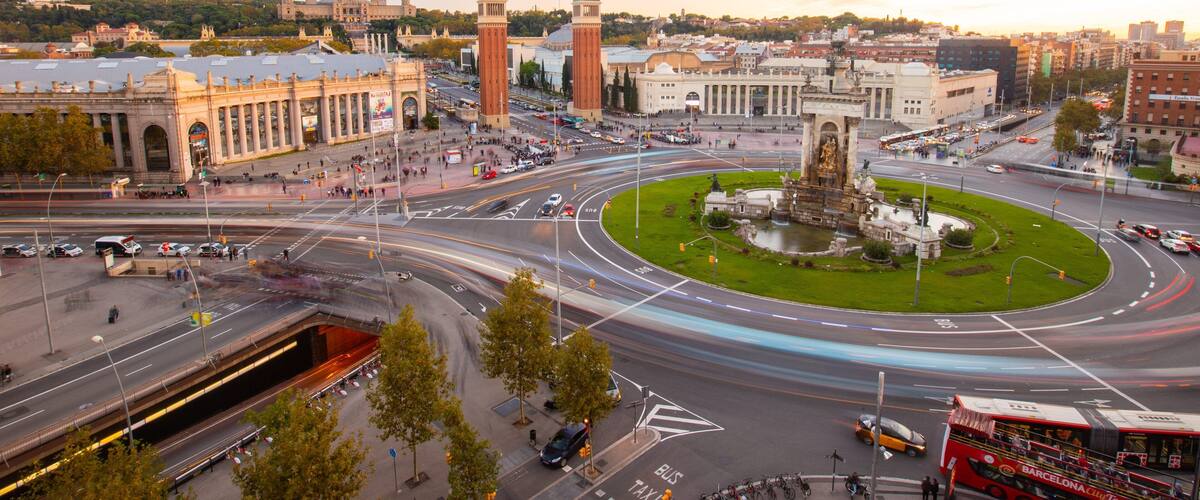 Placa d\'Espanya which includes a sunset, landscape views and a city
