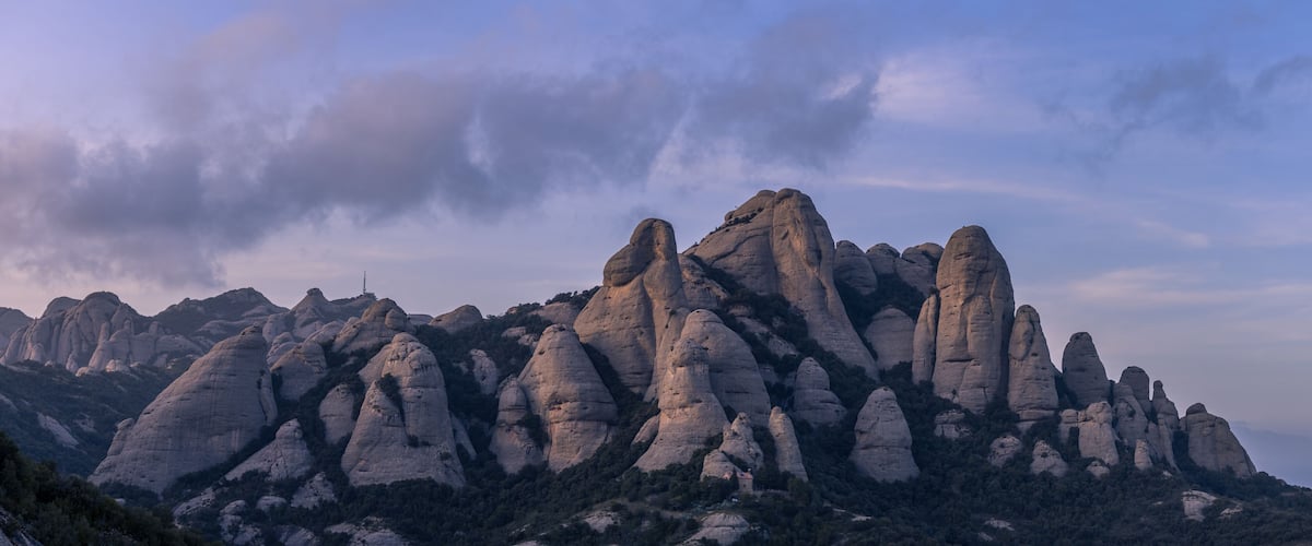 A rugged mountain range with prominent rock formations.