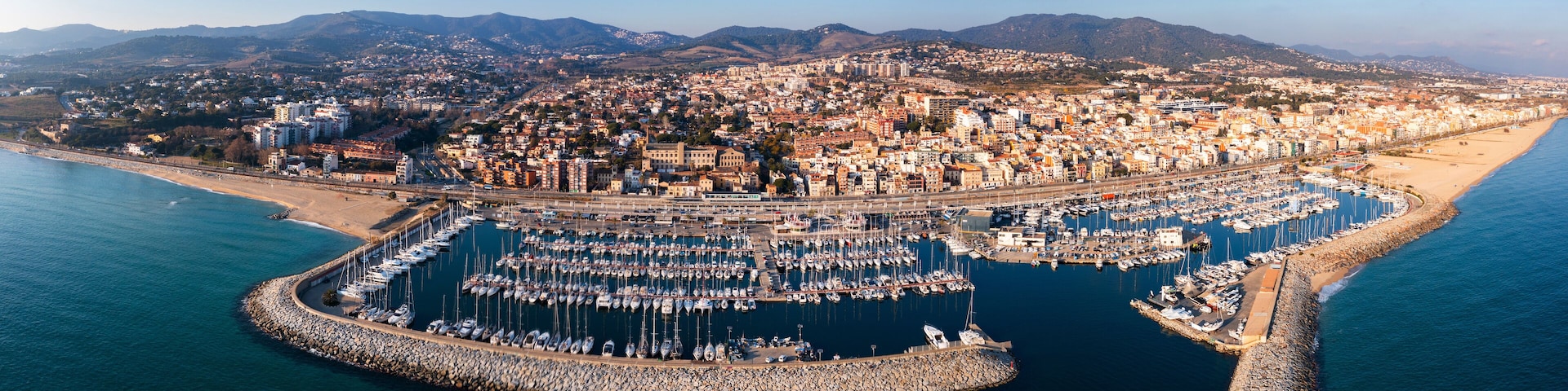 Aerial panoramic view of coastal El Masnou city, Catalonia, Spain