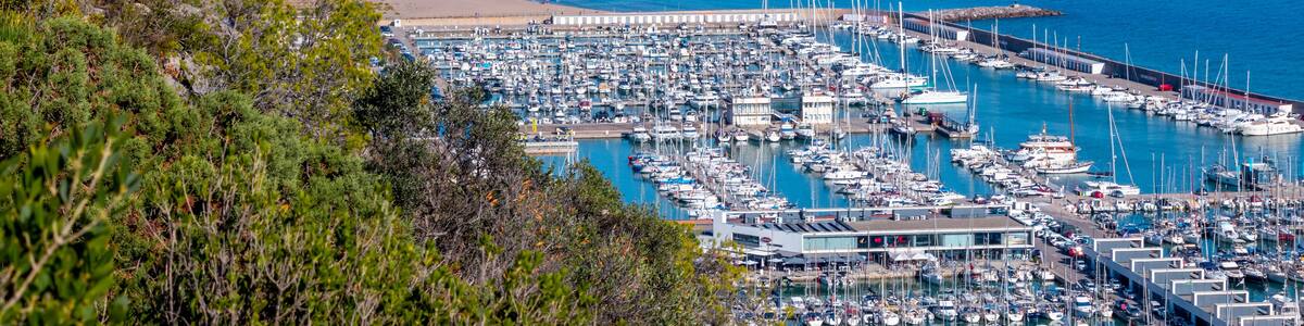 Views of Castelldefels and the beach, Port Ginesta harbor with sailing boats, near Barcelona, Spain