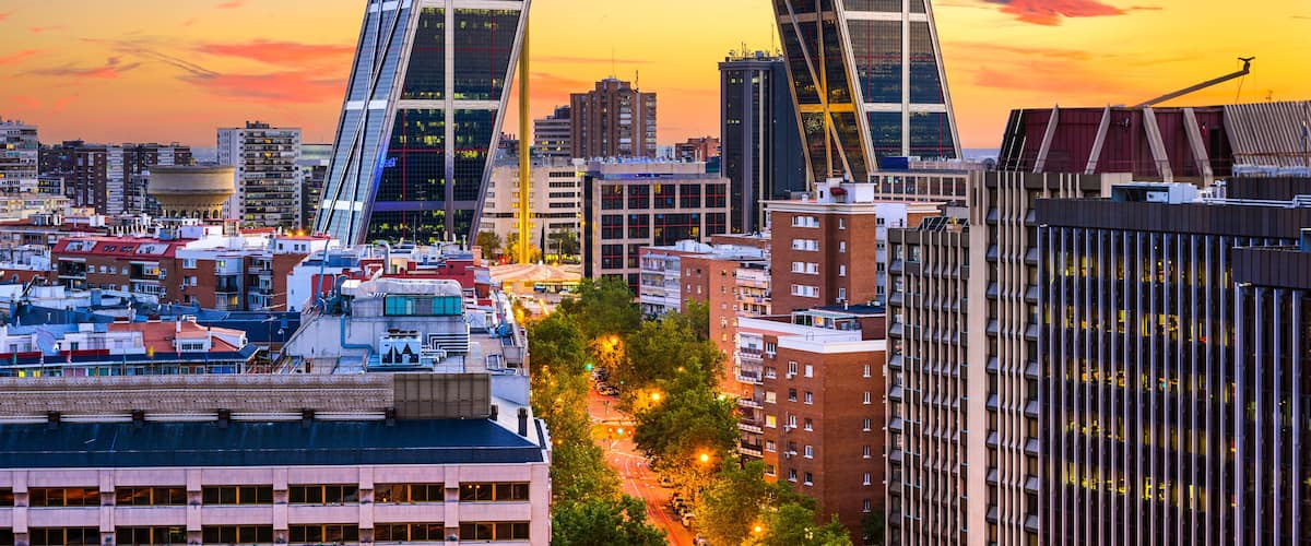 Madrid, Spain financial district skyline at twilight viewed towards the Gates of Europe.; Shutterstock ID 246261865