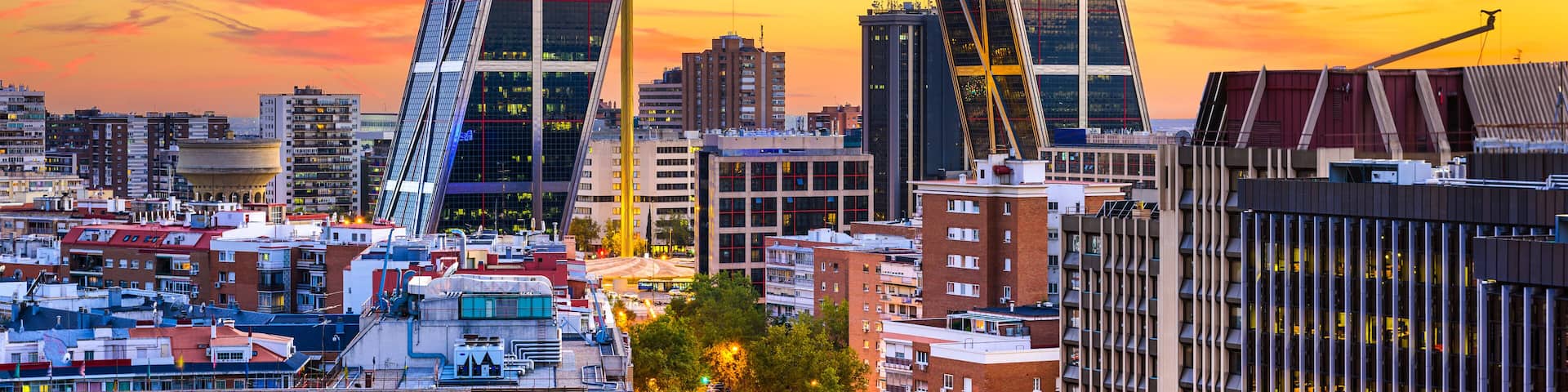 Madrid, Spain financial district skyline at twilight viewed towards the Gates of Europe.; Shutterstock ID 246261865