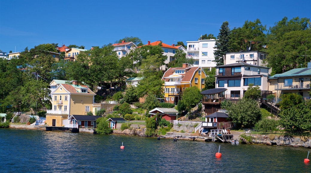 Drottningholm which includes a small town or village and a lake or waterhole