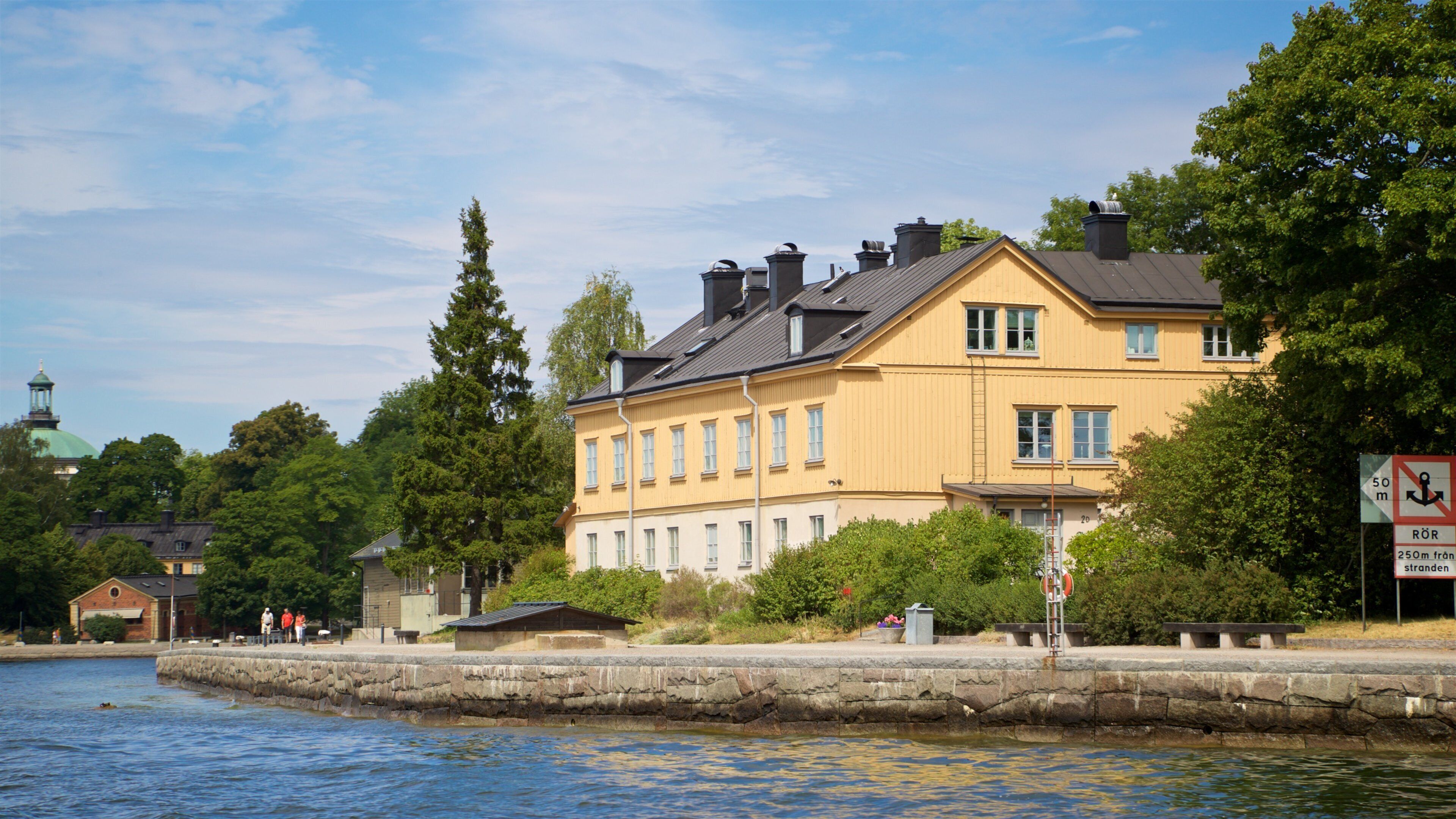 Skeppsholmen showing a small town or village and a lake or waterhole