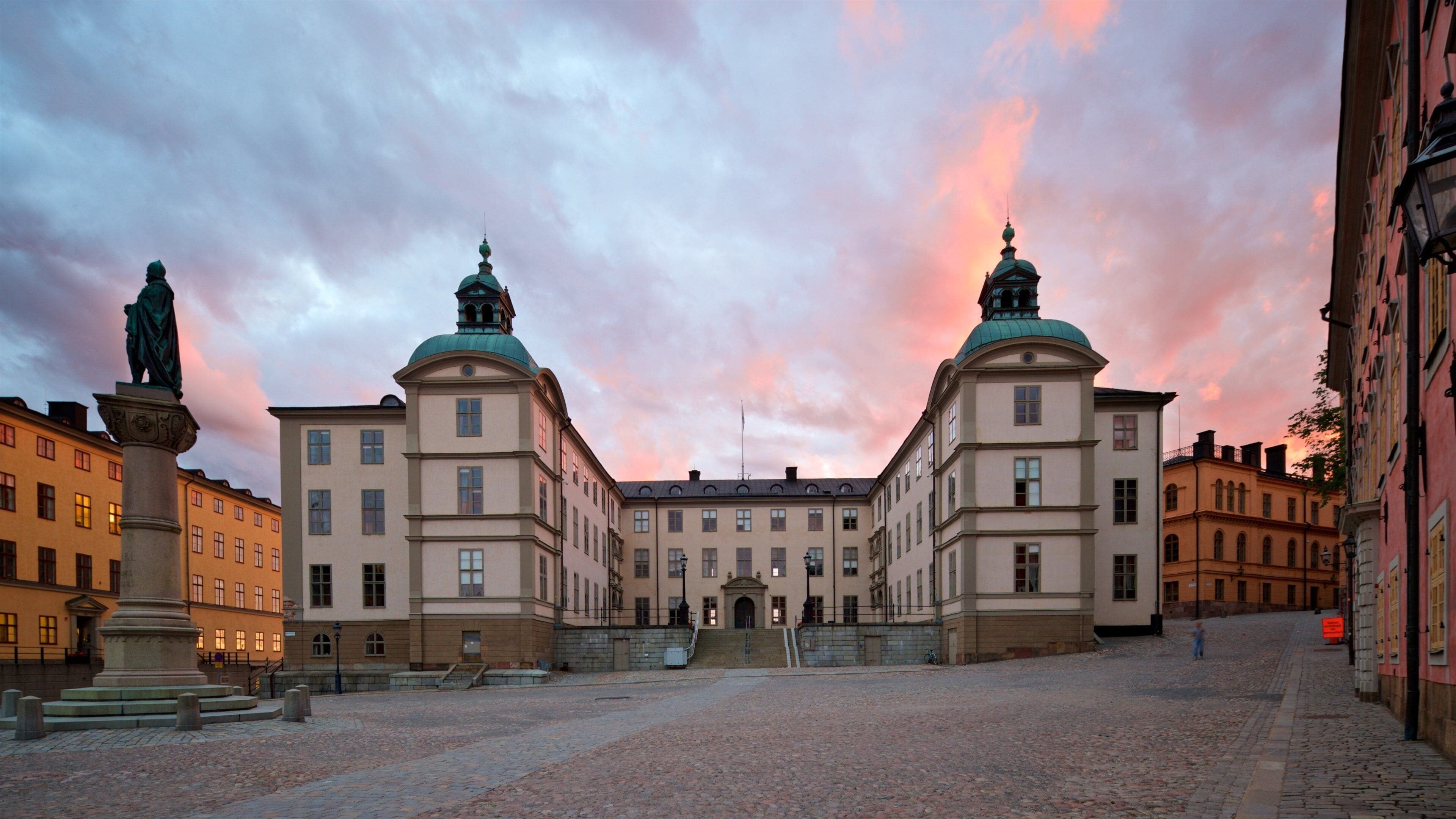 Riddarholmen showing a sunset and a city