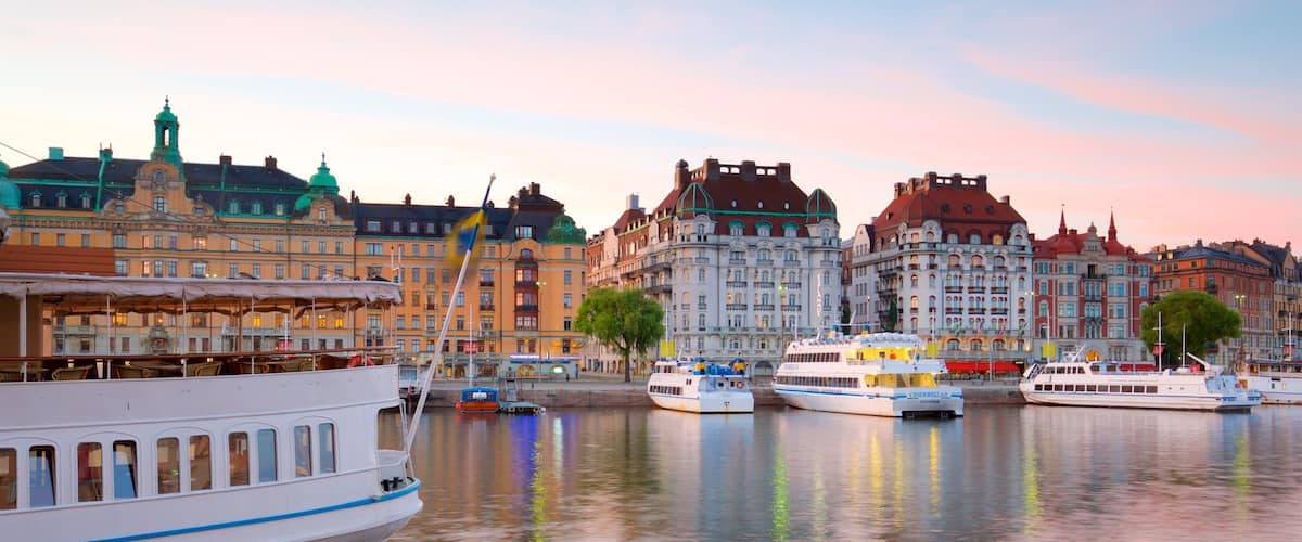 Ostermalm which includes a bay or harbor, a sunset and a city