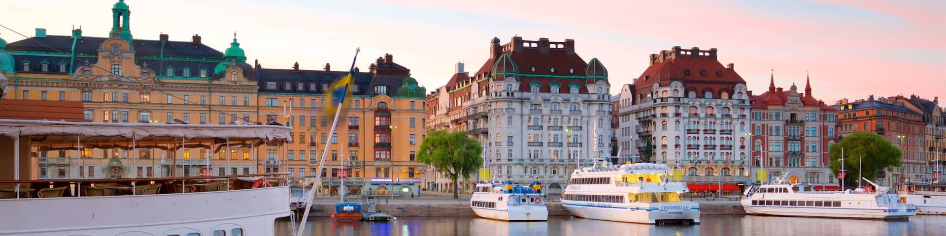 Ostermalm which includes a bay or harbor, a sunset and a city