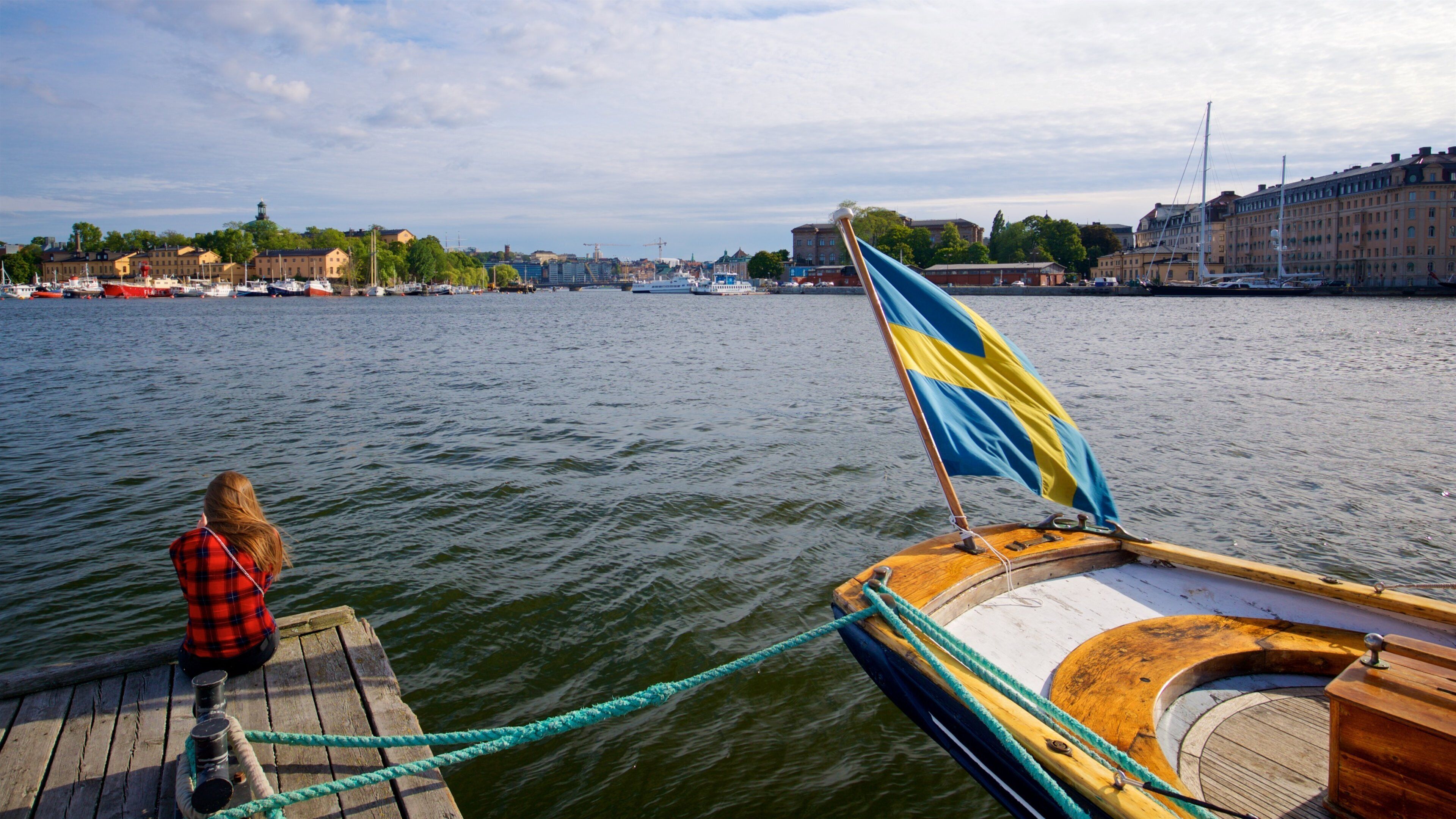 Ostermalm showing a bay or harbor as well as an individual femail