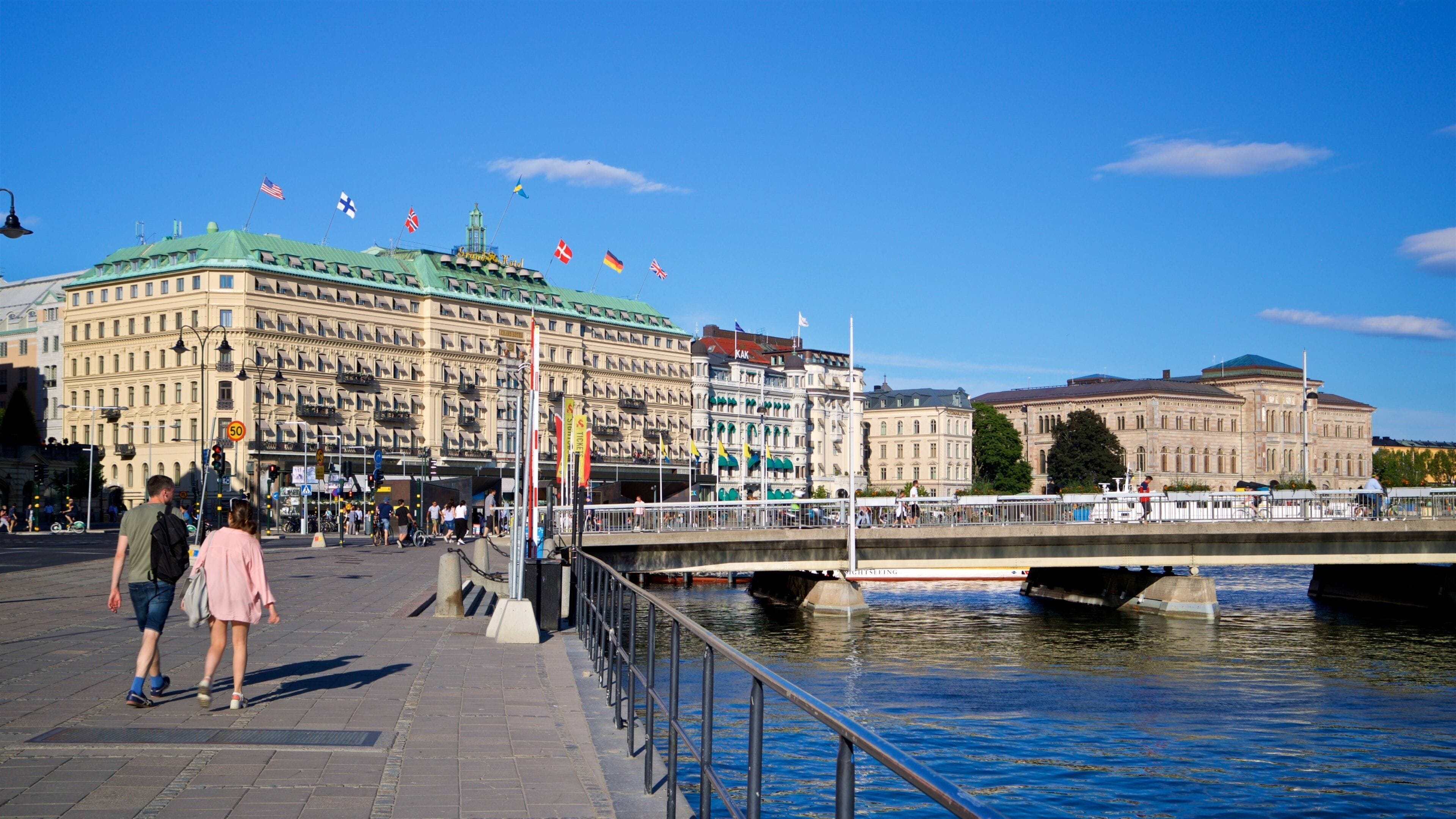 Norrmalm which includes heritage architecture, a river or creek and street scenes