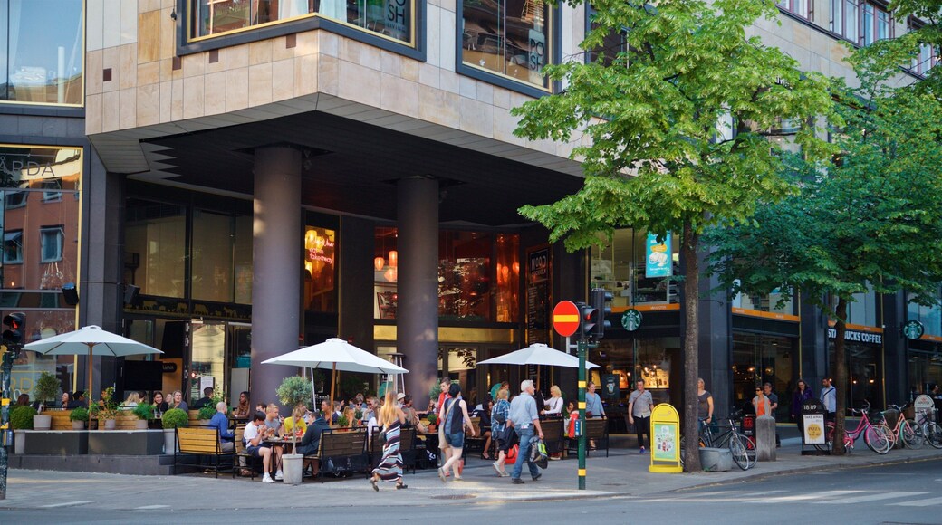 Norrmalm featuring street scenes as well as a small group of people