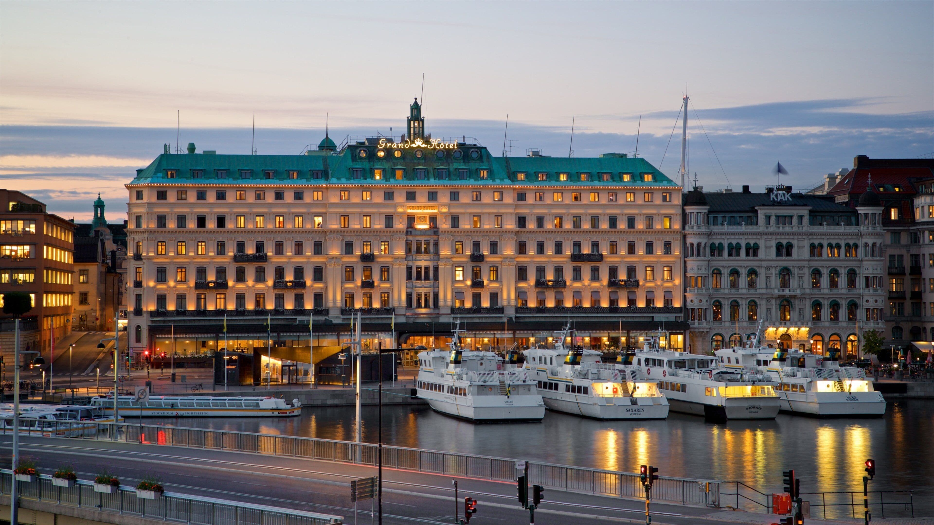 Norrmalm which includes a city, heritage architecture and a sunset