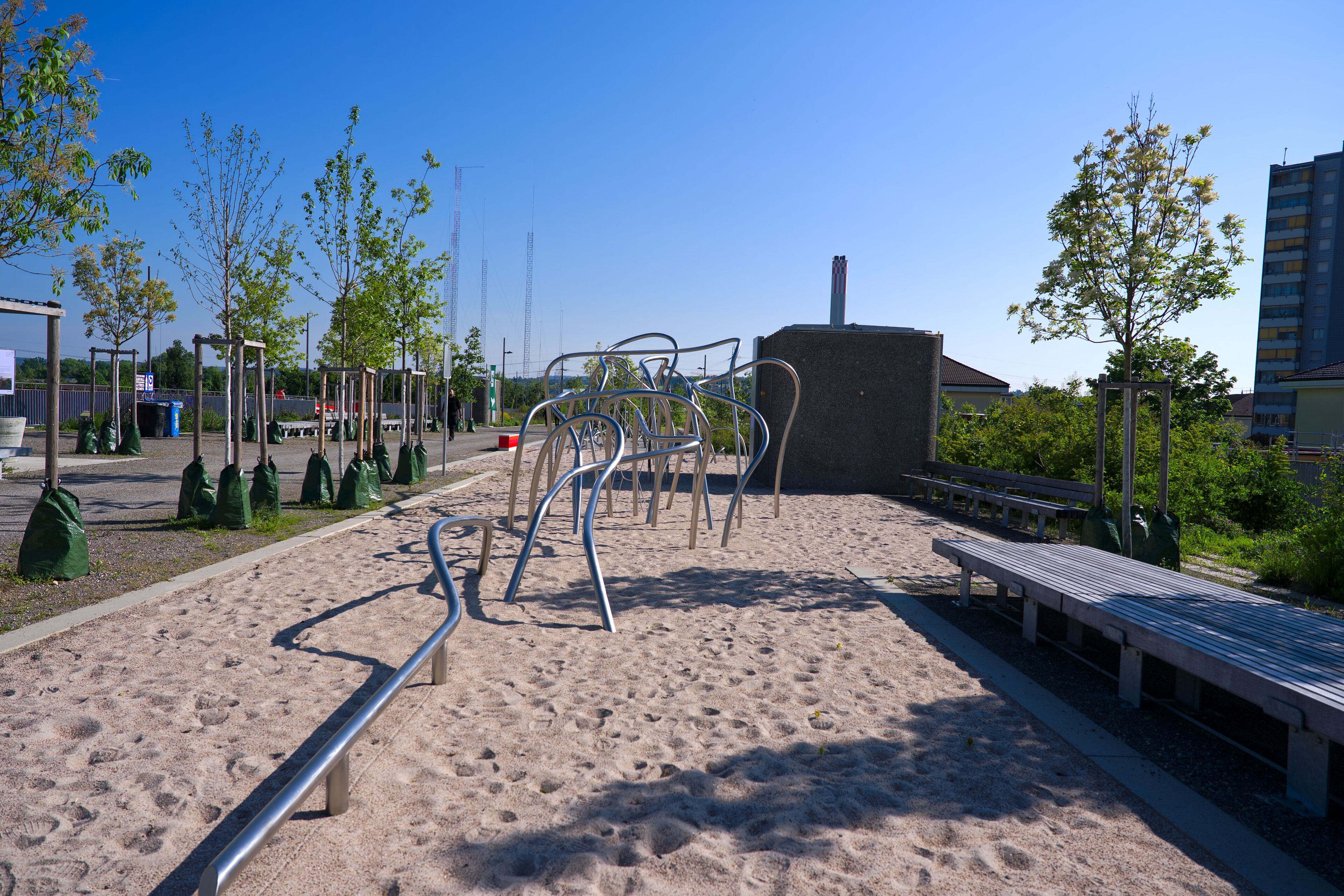 Scenic view of public park named Ueberlandpark with playground on a sunny spring morning. Photo taken May 10th, 2025, Zurich Schwamendingen, Switzerland.