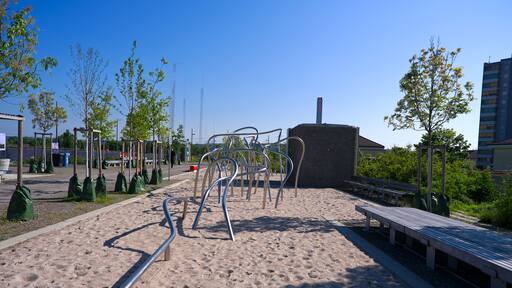 Scenic view of public park named Ueberlandpark with playground on a sunny spring morning. Photo taken May 10th, 2025, Zurich Schwamendingen, Switzerland.