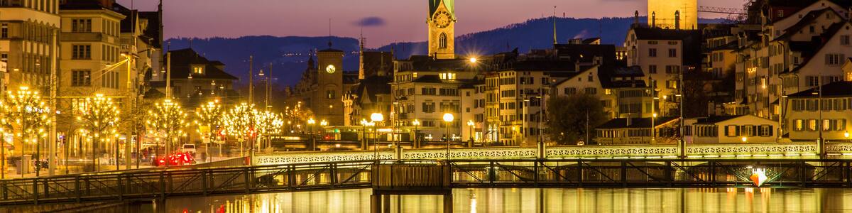 Zurich on banks of Limmat river on a winter evening