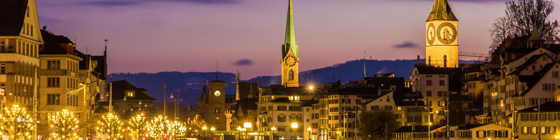 Zurich on banks of Limmat river on a winter evening