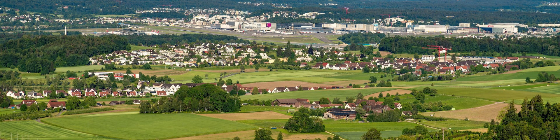 The town of Kloten and Zurich aeroport in Switzerland -panoramic view from Regensberg