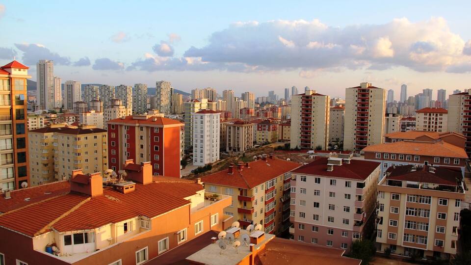 A cityscape with high-rise buildings and a clear sky.