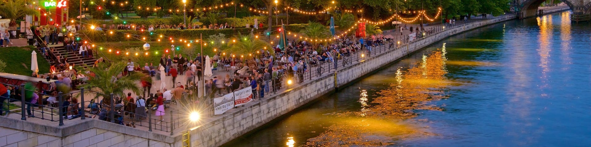 Berlin which includes street scenes and a river or creek as well as a large group of people