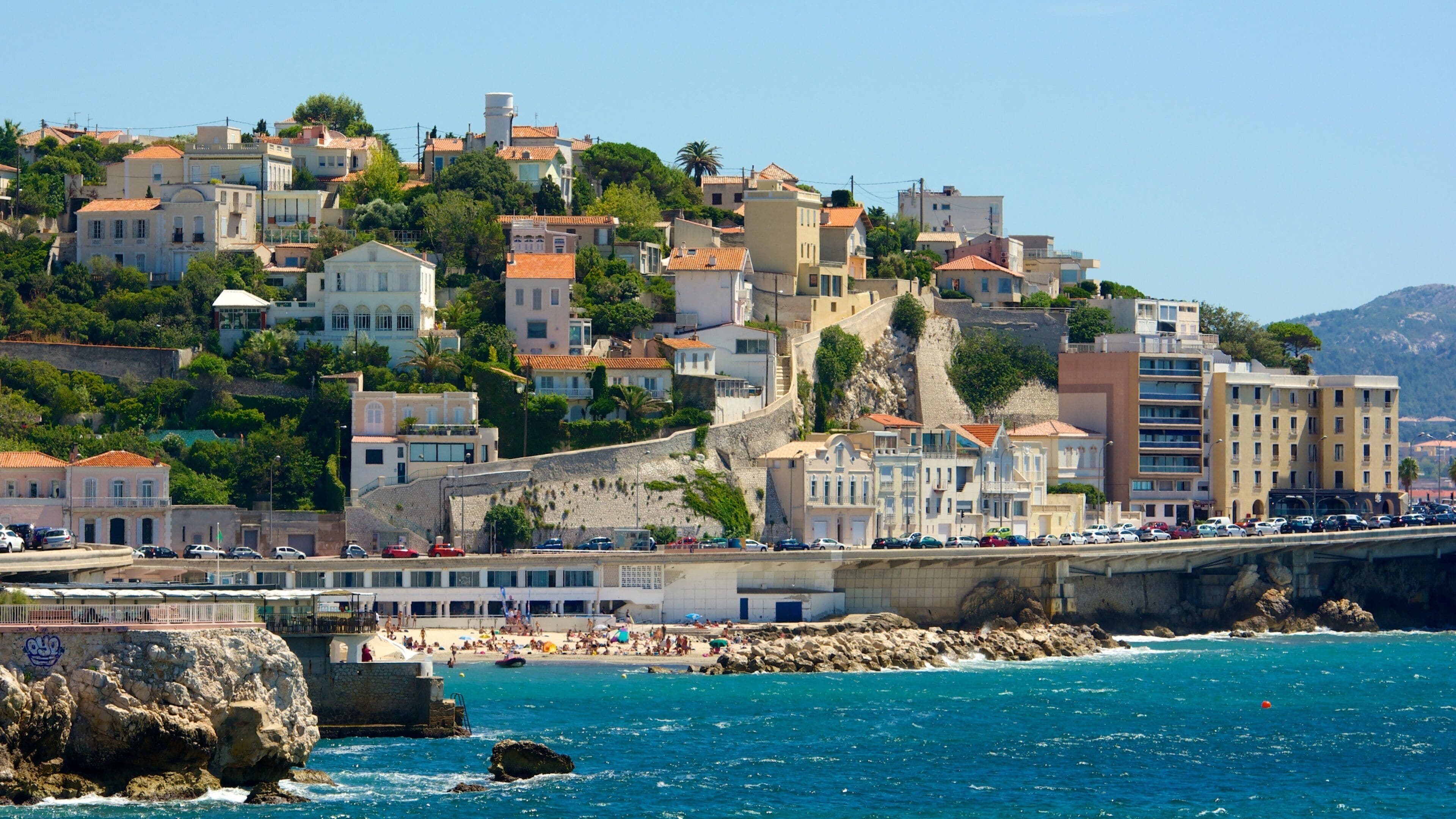 Marseille showing rocky coastline, a coastal town and cbd