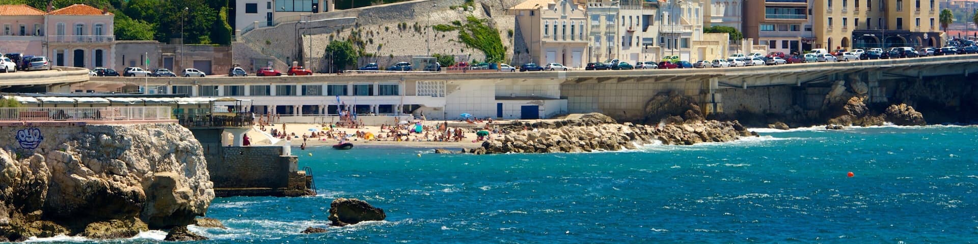 Marseille showing rocky coastline, a coastal town and cbd