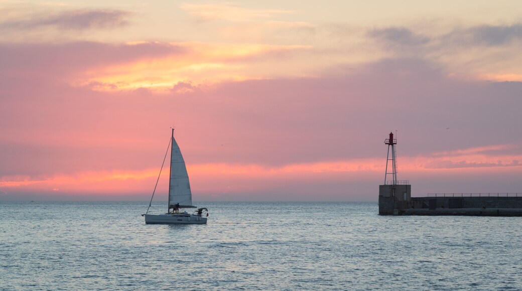 Marseille which includes general coastal views, sailing and a sunset