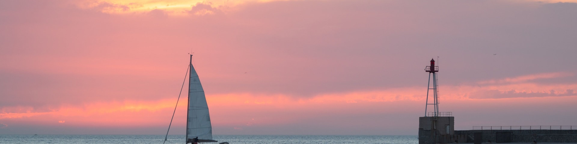 Marseille which includes general coastal views, sailing and a sunset