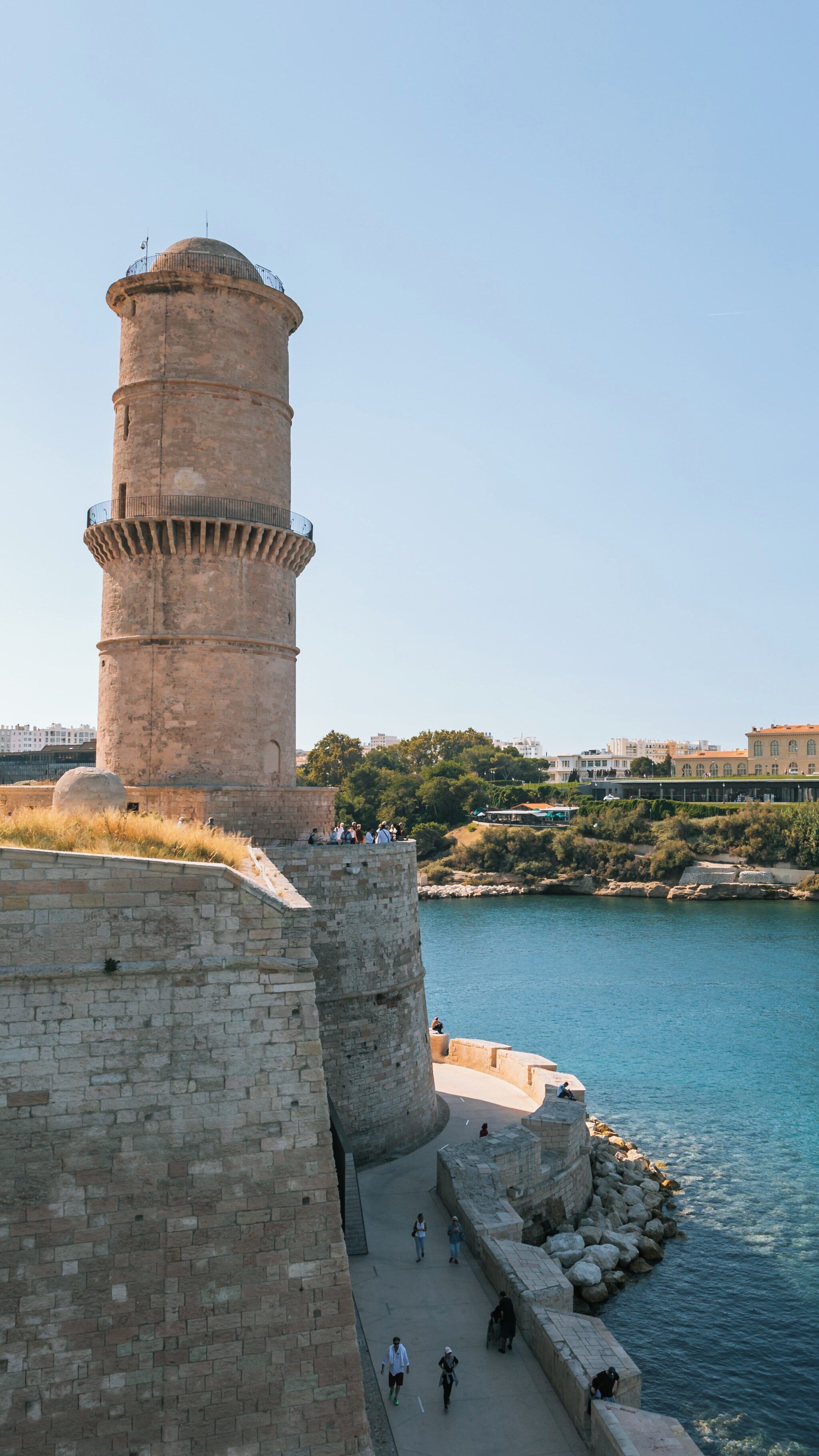Exploration of Fort Saint Jean by the harbor in Quartier du Panier, Marseille, showcasing its historic architecture and stunning coastal views