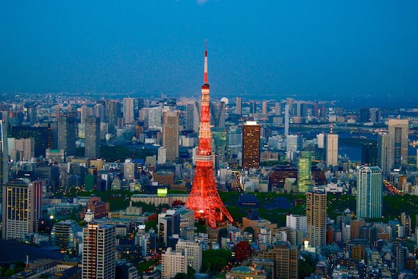 Tokyo which includes night scenes, modern architecture and a city