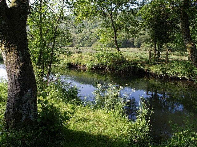 River Lyd. The Lyd, placidly flowing to the right, just above 458671. Beyond the floodplain rises Hartly Wood.