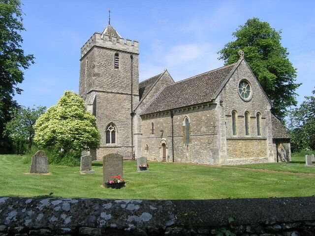 A church with a tower and a graveyard.