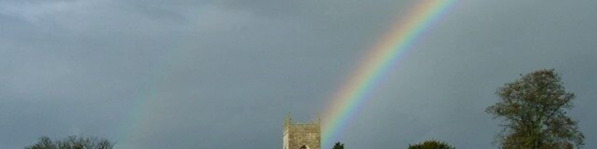 A double rainbow behind the tower of St Mary and St Edburga's parish church, Stratton Audley, Oxfordshire