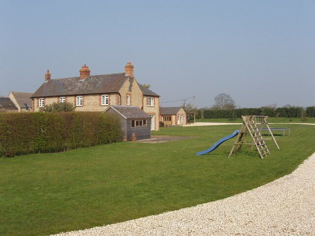 New Barn Farm, Weston on the Green The line of the public footpath is across the grass between the play equipment and the house - I walked discreetly round the drive.