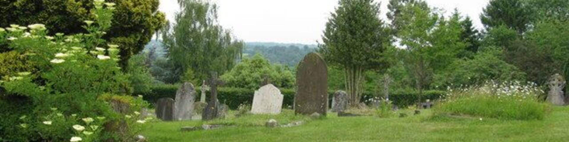 Gravestones in cemetery in Danehill The cemetery is on the opposite side of the road to the church