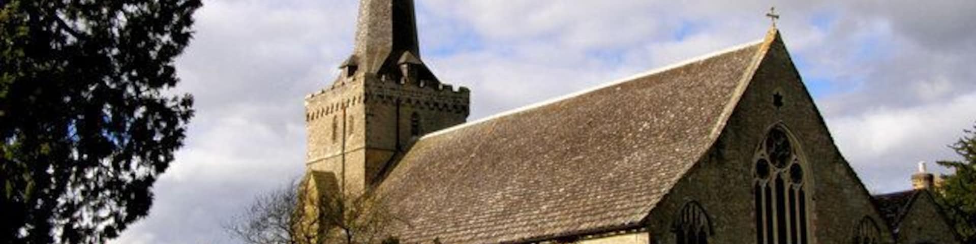 Holy Trinity Church, Cuckfield Unusually, not only the church but many tombstones and the lych gate have been listed.