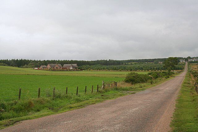 North-South road to and from Archiestown. A dwelling in Monahoudie Moss is on the left.