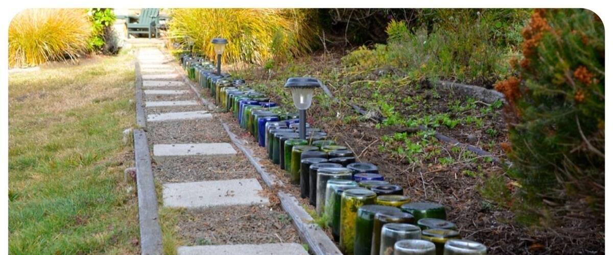 They started to decorate their garden with empty bottles of wine about 6 months ago and look what happened inside. The bottles became little terrariums.   Awesome!