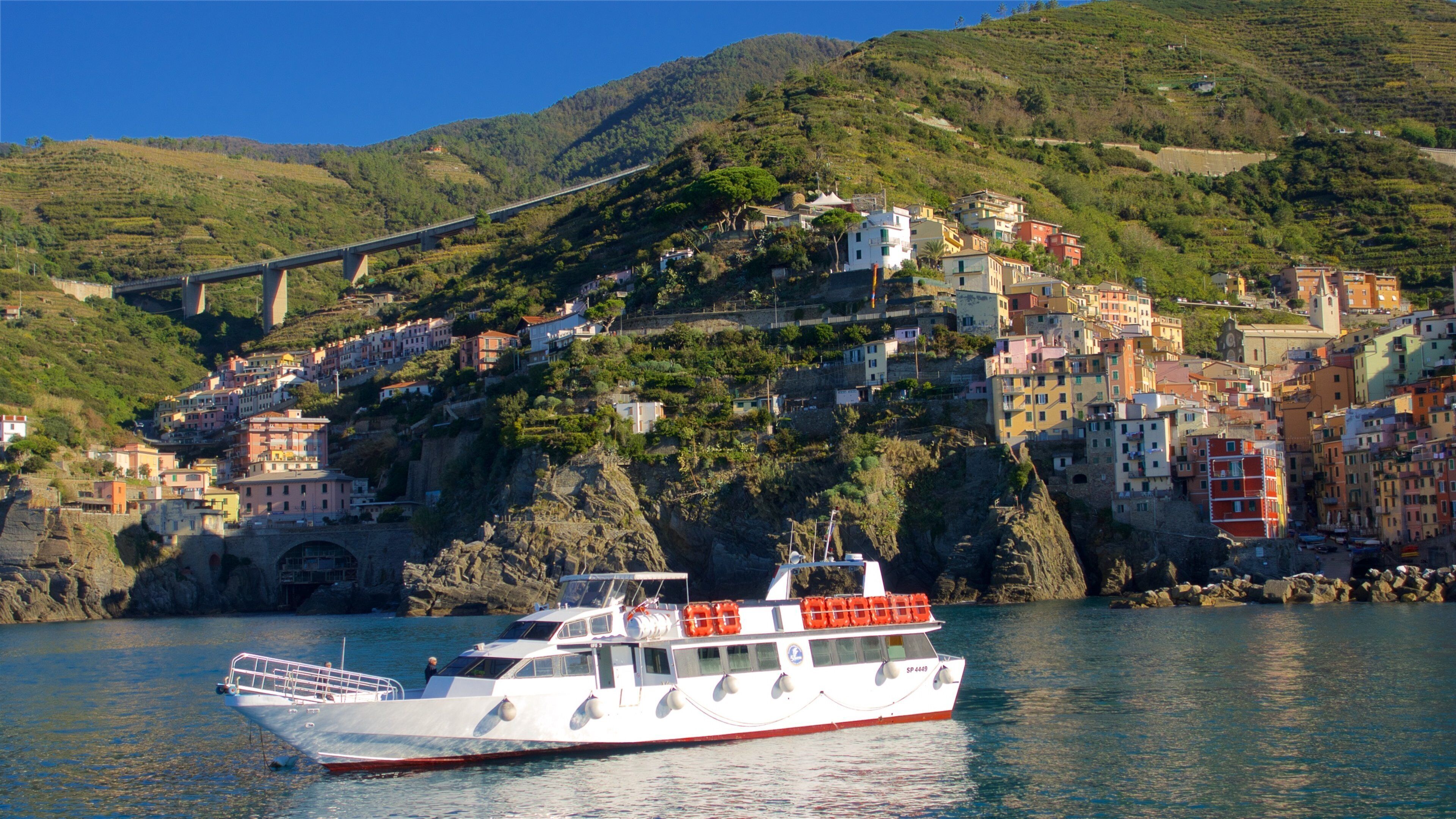 Riomaggiore showing boating, mountains and a bay or harbor
