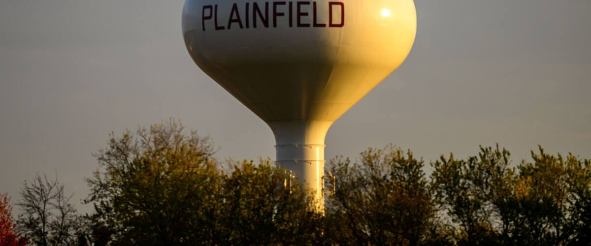 A water tower with the word "PLAINFIELD" on it.