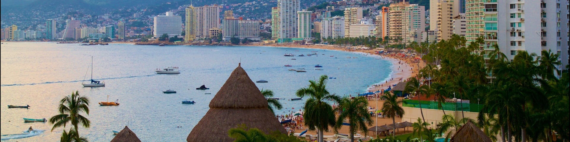 Acapulco featuring general coastal views, a city and a sunset