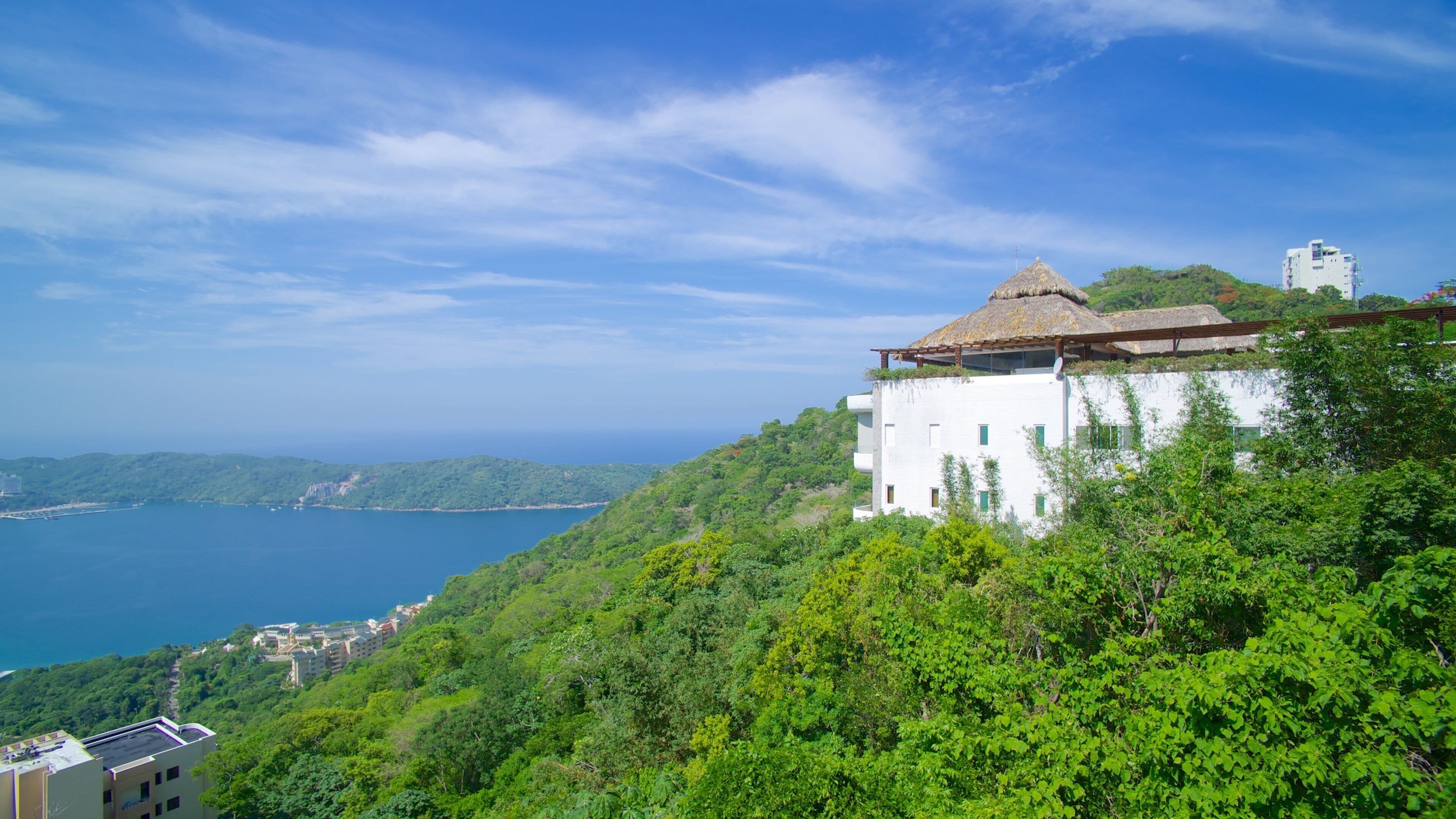 Acapulco which includes general coastal views, a house and mountains