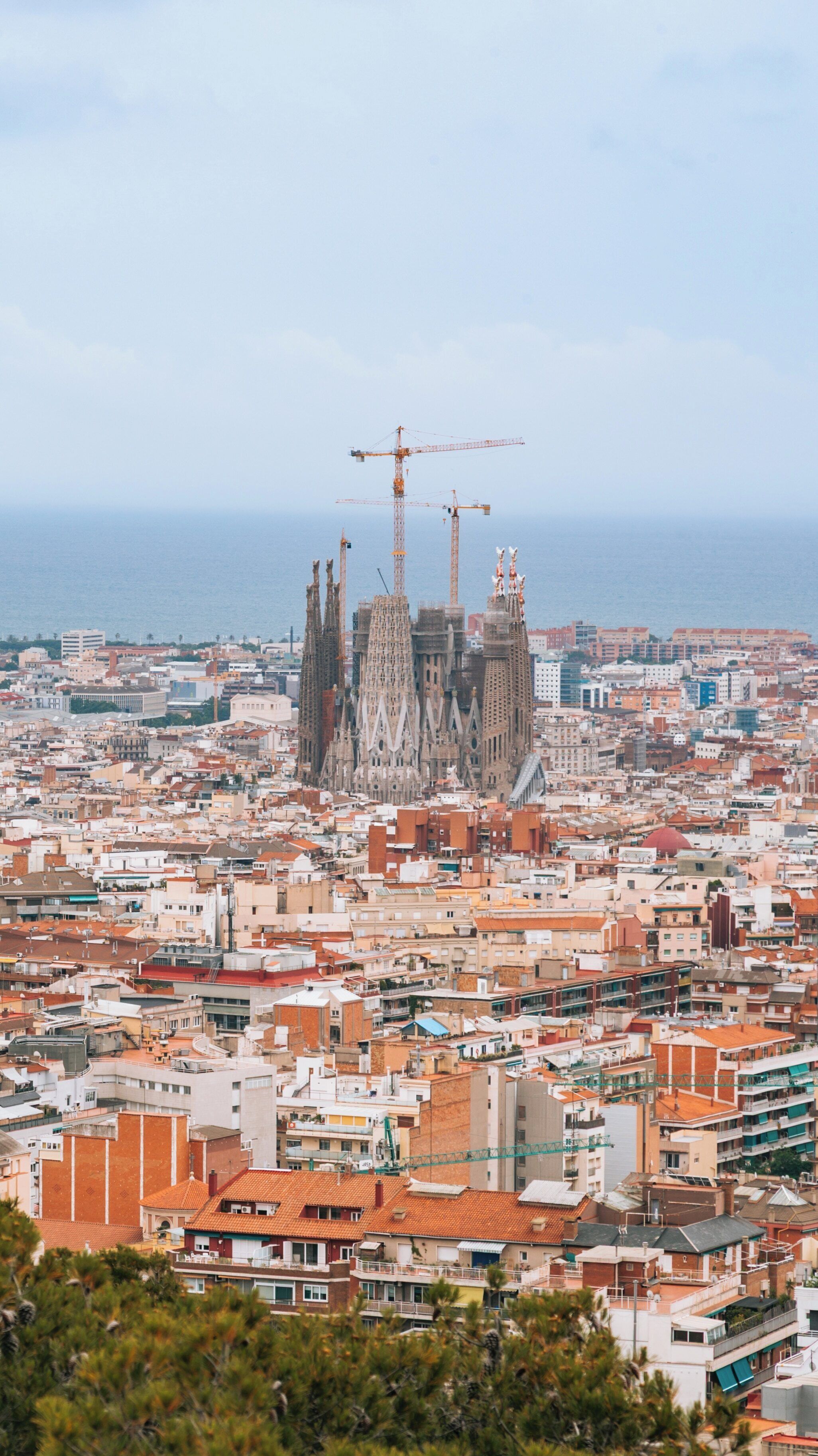 Exploring Park Guel with its colorful mosaics and stunning views of the Sagrada Familia under construction in Barcelona