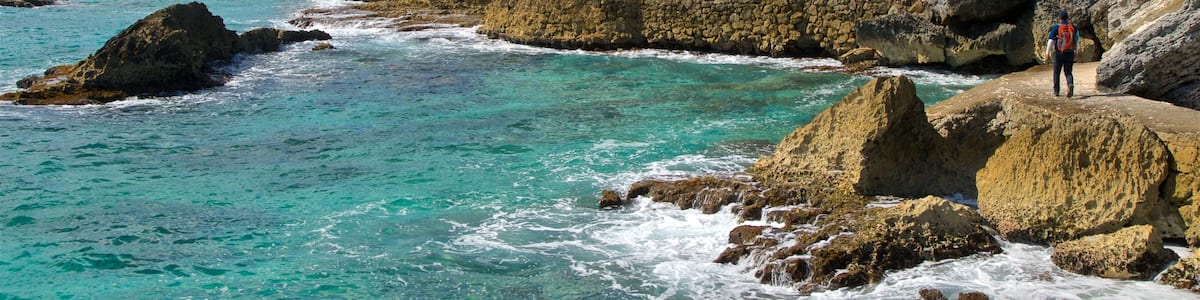 Isla Mujeres which includes rocky coastline and general coastal views