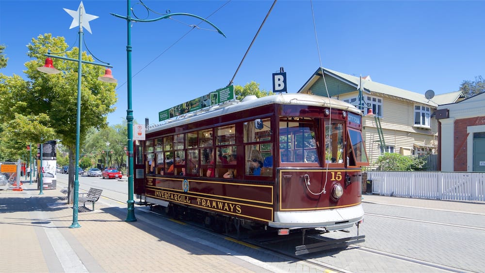 A vintage tram with the number 15, labeled "City Tour," parked on a tramway track.