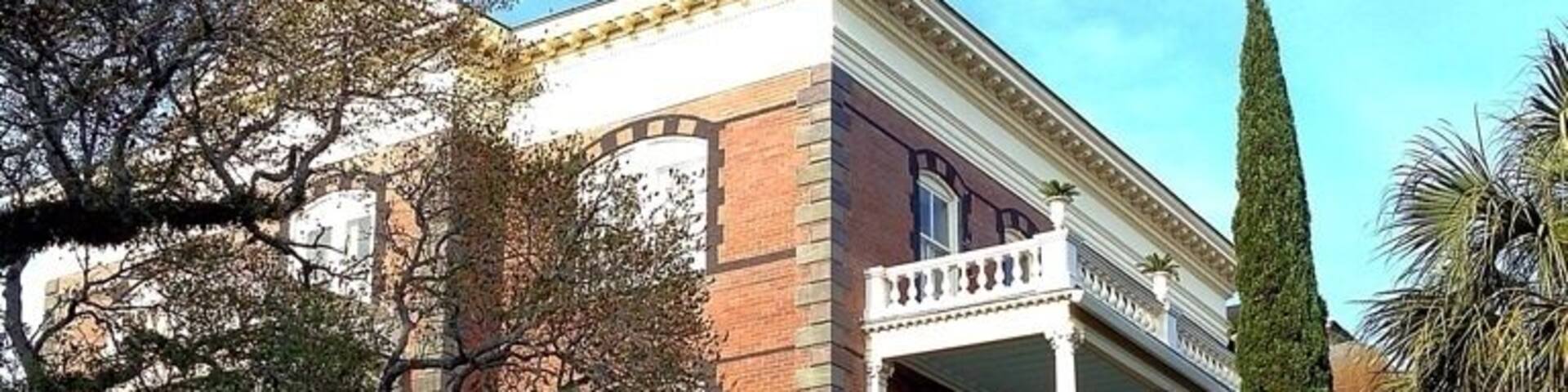 Almost a century before it was built, the ground on which George Walton Williams would build his home was hallowed in the tradition of optimistic patriotism. 14-16 Meeting Street in downtown Charleston was originally part of the plot of the Lowndes House, the property of Gov. Charles Pinckney, who hosted George Washington three times in May of 1791.
Mr. Williams was highly regarded throughout Charleston as a business man and humanitarian. Having amassed a great fortune throughout his life, Mr. Williams decided to build a grand residence at 16 Meeting Street as a testament to his desire for the reemergence of Charleston following the Civil War. The construction of the house took five years and required the talents of hundreds of otherwise unemployable local artisans and craftsmen for its creation.
After Mr. Williams's death in 1903, the house went through a succession of occupants and uses, gradually deteriorating until, in 1972, it was condemned. The house was subsequently purchased by a Charleston native who spent the next 25 years and 5 million dollars restoring it.