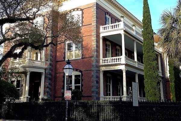 Almost a century before it was built, the ground on which George Walton Williams would build his home was hallowed in the tradition of optimistic patriotism. 14-16 Meeting Street in downtown Charleston was originally part of the plot of the Lowndes House, the property of Gov. Charles Pinckney, who hosted George Washington three times in May of 1791.
Mr. Williams was highly regarded throughout Charleston as a business man and humanitarian. Having amassed a great fortune throughout his life, Mr. Williams decided to build a grand residence at 16 Meeting Street as a testament to his desire for the reemergence of Charleston following the Civil War. The construction of the house took five years and required the talents of hundreds of otherwise unemployable local artisans and craftsmen for its creation.
After Mr. Williams's death in 1903, the house went through a succession of occupants and uses, gradually deteriorating until, in 1972, it was condemned. The house was subsequently purchased by a Charleston native who spent the next 25 years and 5 million dollars restoring it.