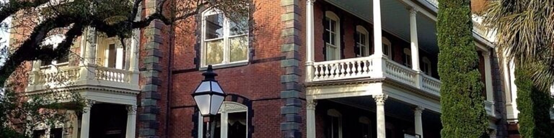 Almost a century before it was built, the ground on which George Walton Williams would build his home was hallowed in the tradition of optimistic patriotism. 14-16 Meeting Street in downtown Charleston was originally part of the plot of the Lowndes House, the property of Gov. Charles Pinckney, who hosted George Washington three times in May of 1791.
Mr. Williams was highly regarded throughout Charleston as a business man and humanitarian. Having amassed a great fortune throughout his life, Mr. Williams decided to build a grand residence at 16 Meeting Street as a testament to his desire for the reemergence of Charleston following the Civil War. The construction of the house took five years and required the talents of hundreds of otherwise unemployable local artisans and craftsmen for its creation.
After Mr. Williams's death in 1903, the house went through a succession of occupants and uses, gradually deteriorating until, in 1972, it was condemned. The house was subsequently purchased by a Charleston native who spent the next 25 years and 5 million dollars restoring it.