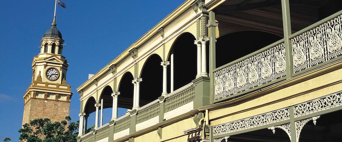 A building with a clock tower and ornate balconies.