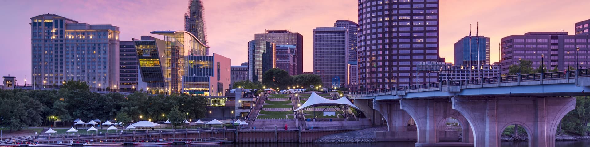 The skyline of downtown Hartford, Connecticut at dusk from across the Connecticut River.